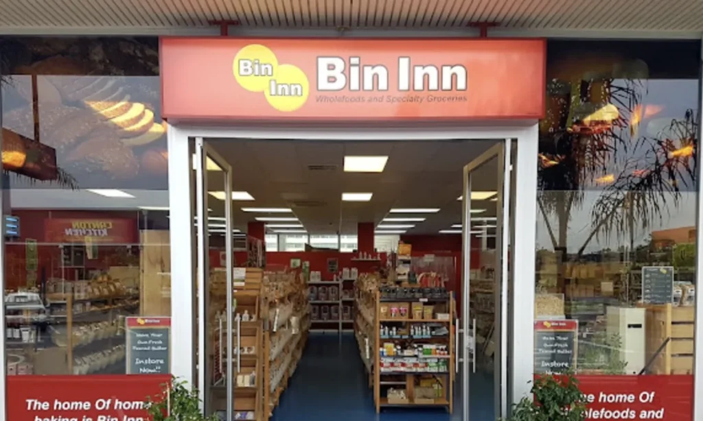 Entrance to the Bin Inn wholefoods and specialty grocery store in Palmerston North, with open glass doors