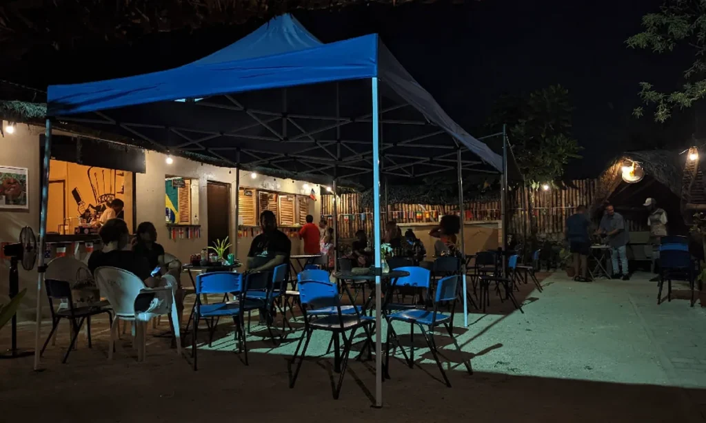 Outdoor seating under blue tents at Kava Lounge in Port Vila