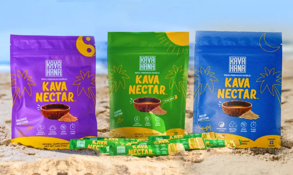 Three bags of Kava Hana Kava Nectar powder displayed on sand at the beach
