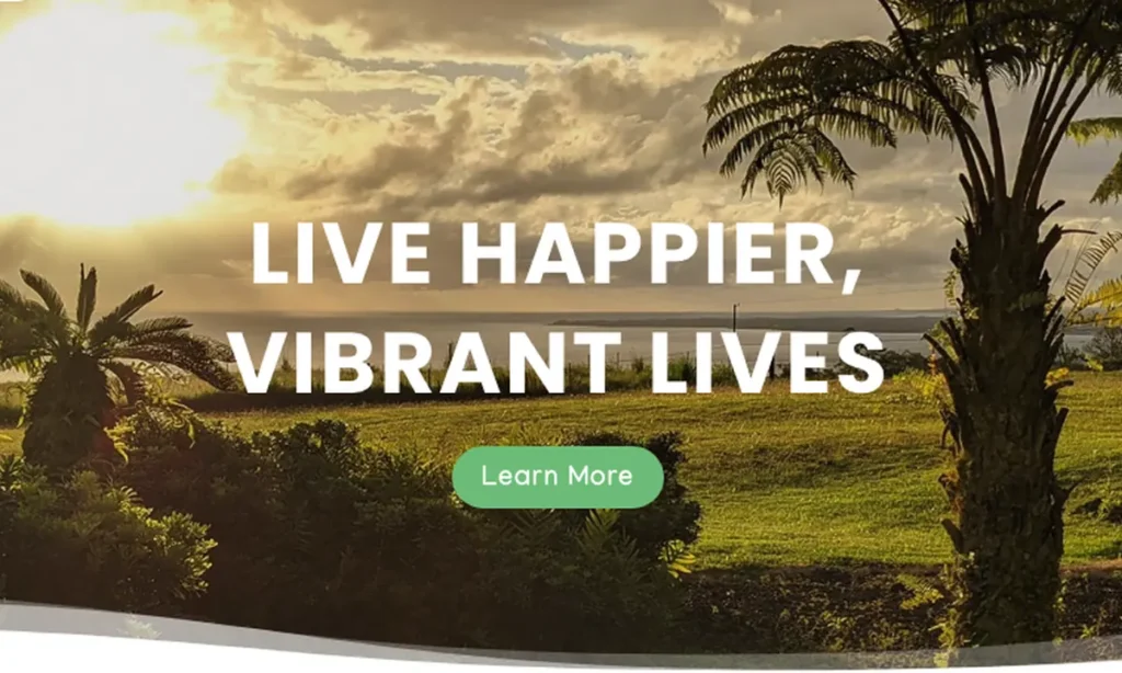 Website banner reading 'Live Happier, Vibrant Lives' over a sunset palm tree scene